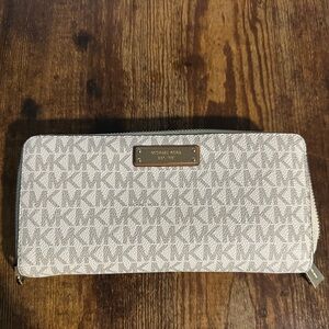 Michael Kors Jet Set Travel Large Logo Continental Wristlet in the vanilla color